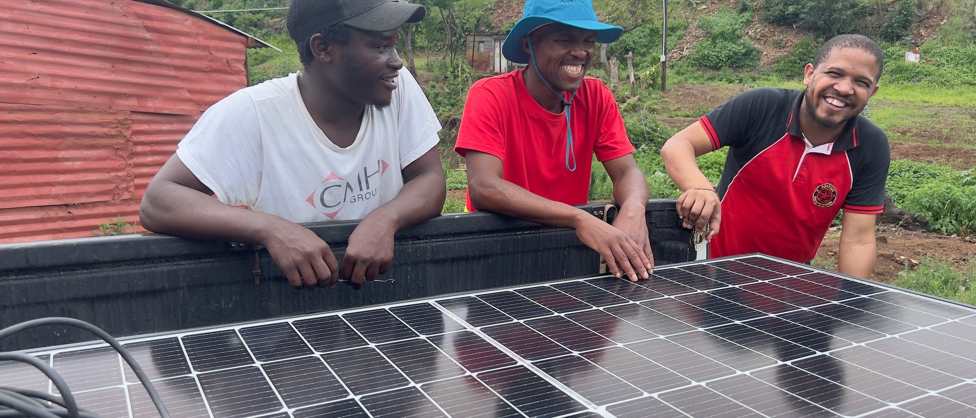 Community members working together on a solar installation